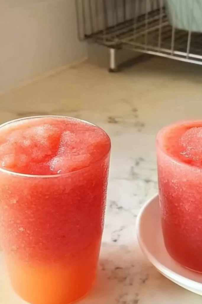Homemade watermelon slushie recipe in glasses on kitchen counter - easy summer drink