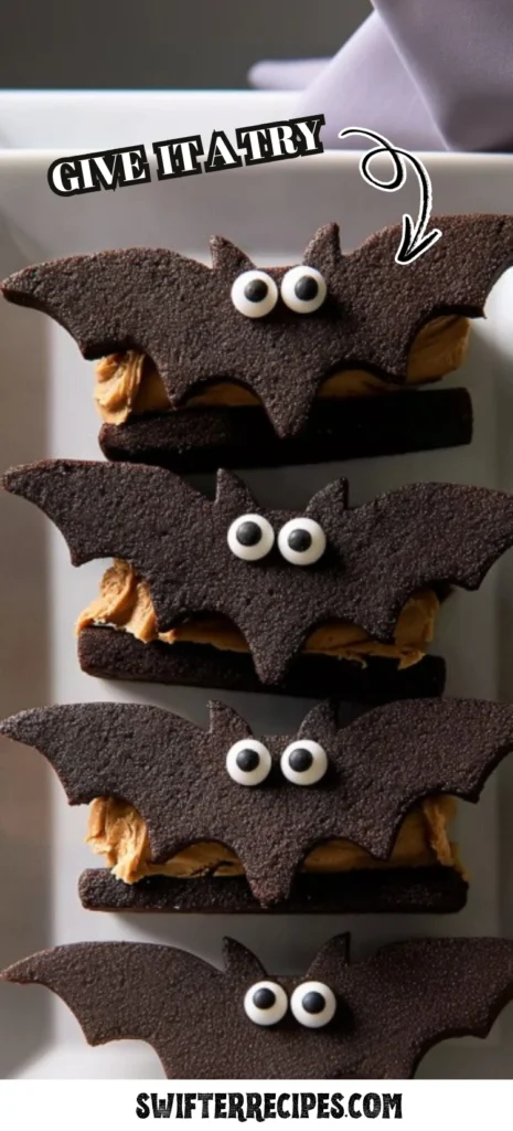 Bat Wing Chocolate Pretzel Mix cookies stacked on a plate, chocolate bat-shaped sandwich cookies with peanut butter filling and candy eyes, perfect kid-friendly Halloween dessert