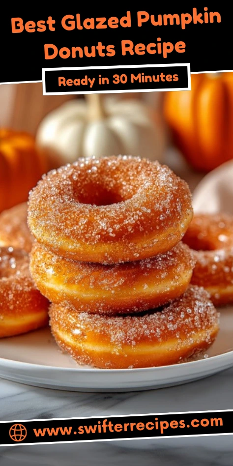Best glazed pumpkin donuts stacked on a plate with sugar coating