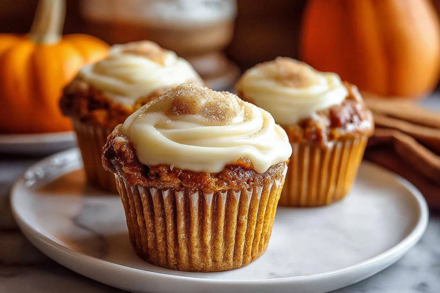 Pumpkin Cream Cheese Muffins with Creamy Frosting and Cinnamon Sugar Topping