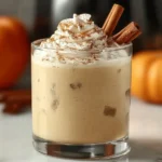 Pumpkin Spice White Russian cocktail with whipped cream and cinnamon
