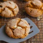 Keto Pumpkin Cheesecake Cookies cooling on a baking rack with cheesecake filling