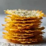Low-Carb Halloween Cheese Crisps stacked golden parmesan snacks with black pepper keto-friendly appetizer