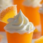 Keto Orange Jello Shots with Whipped Cream and Sugar-Free Candy Garnish
