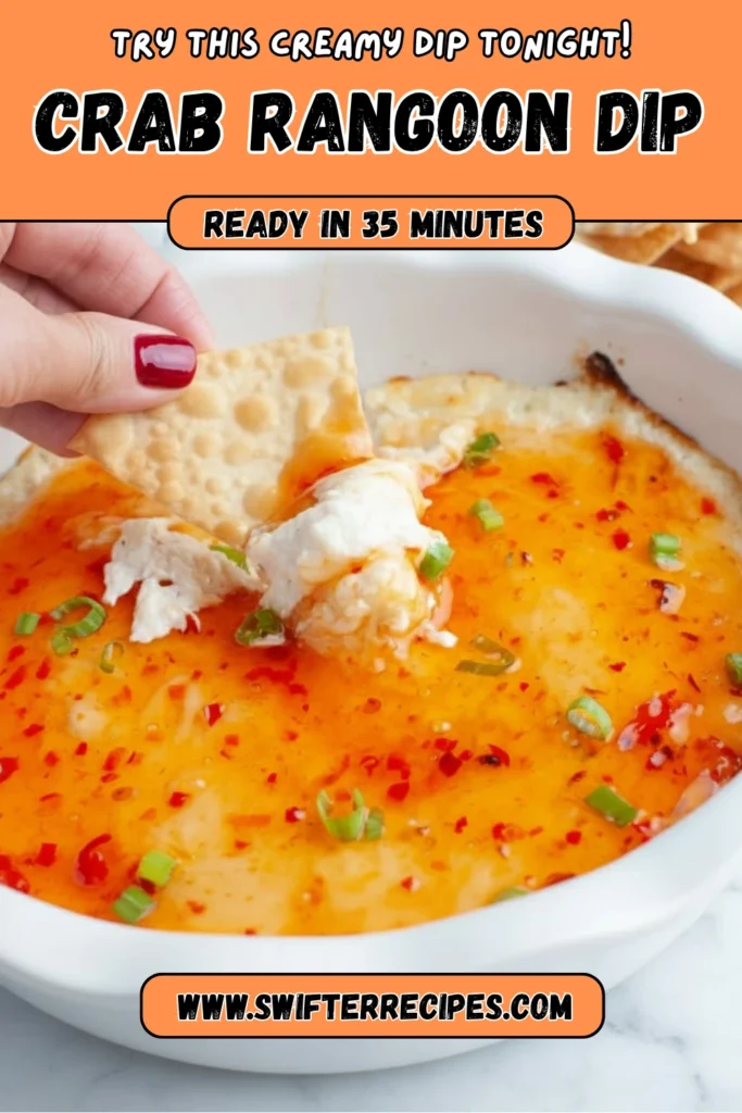 Creamy baked Crab Rangoon Dip topped with sweet chili sauce and green onions served with crackers, ready in 35 minutes