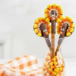 Festive Thanksgiving Turkey Pretzel Rods made with candy corn and chocolate