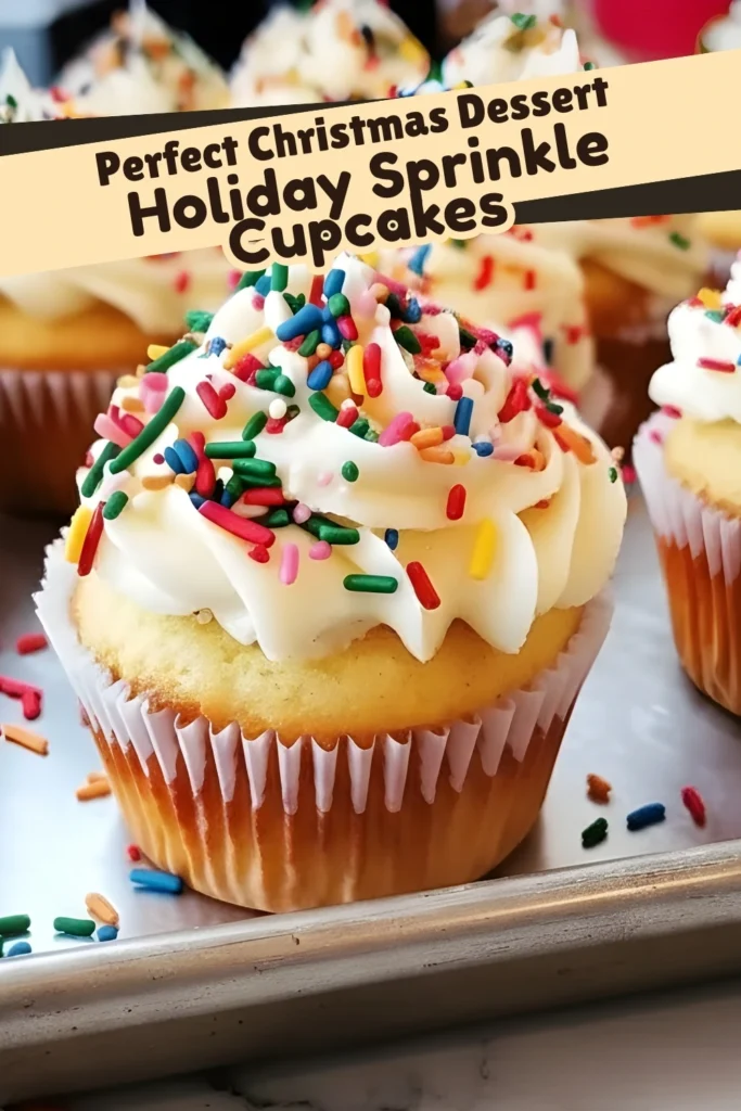 Holiday sprinkle cupcakes with creamy vanilla frosting and colorful sprinkles, labeled as the perfect Christmas dessert on a baking tray.