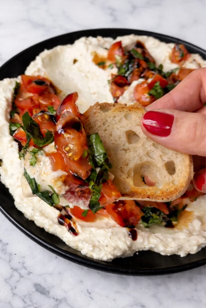 Hand-drawn whipped feta bruschetta dip recipe elements with text and illustrations in black and white