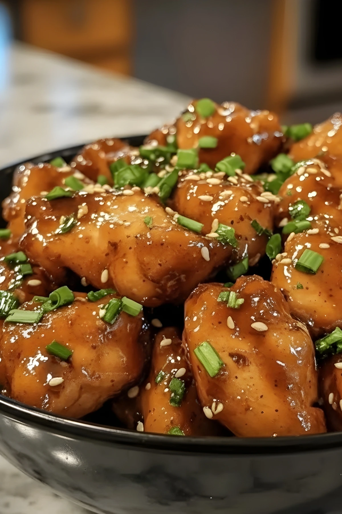 Sticky Honey Garlic Chicken Bites with Sesame and Chopped Green Onions