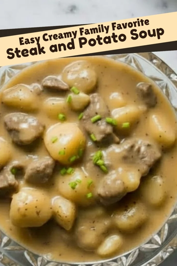 Bowl of creamy steak and potato soup topped with chives, showcasing tender beef chunks and golden potatoes in rich gravy