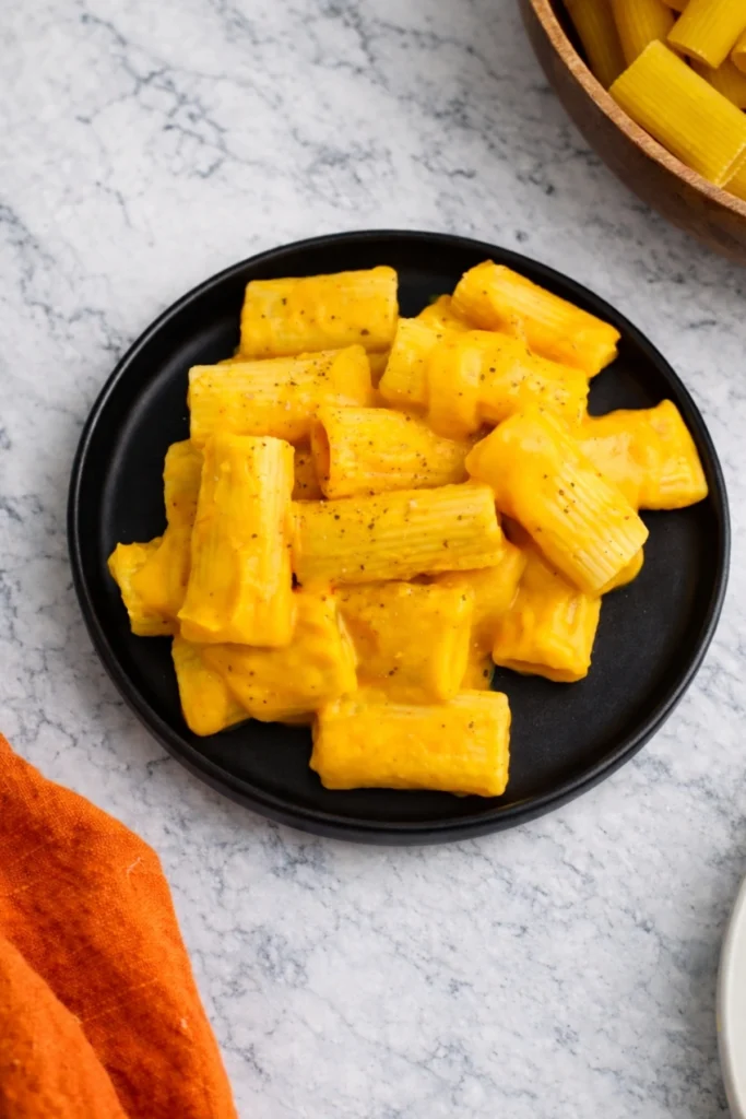 Vegan Butternut Squash Pasta Served on Black Plate