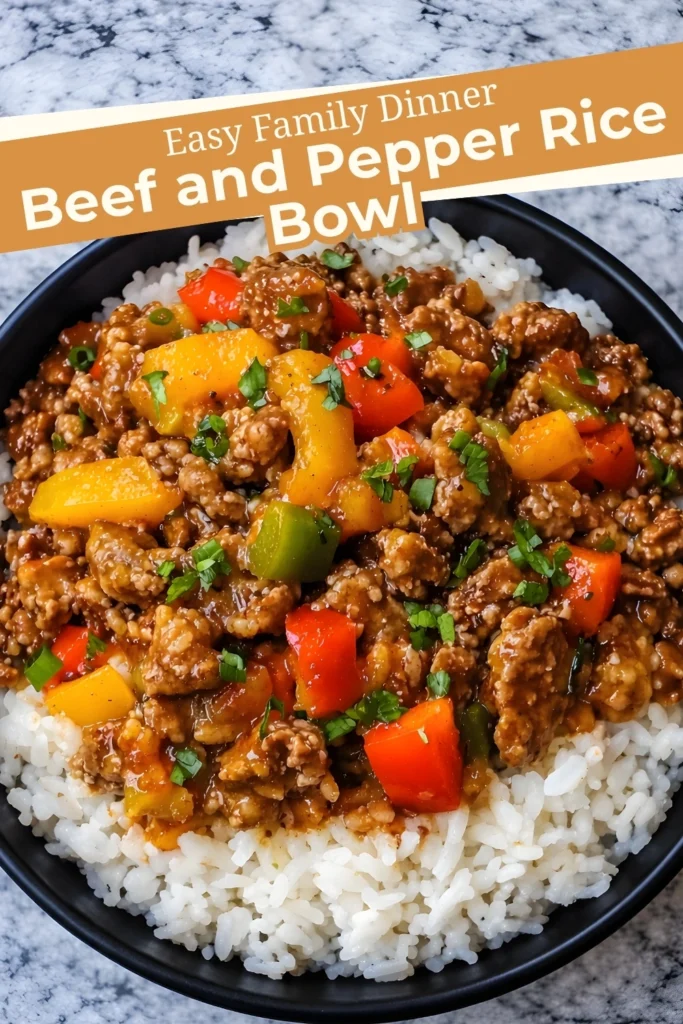 Beef and pepper rice bowl with ground beef and colorful bell peppers served over white rice in a black bowl