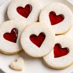 Heart-Shaped Jam Cookies with Powdered Sugar