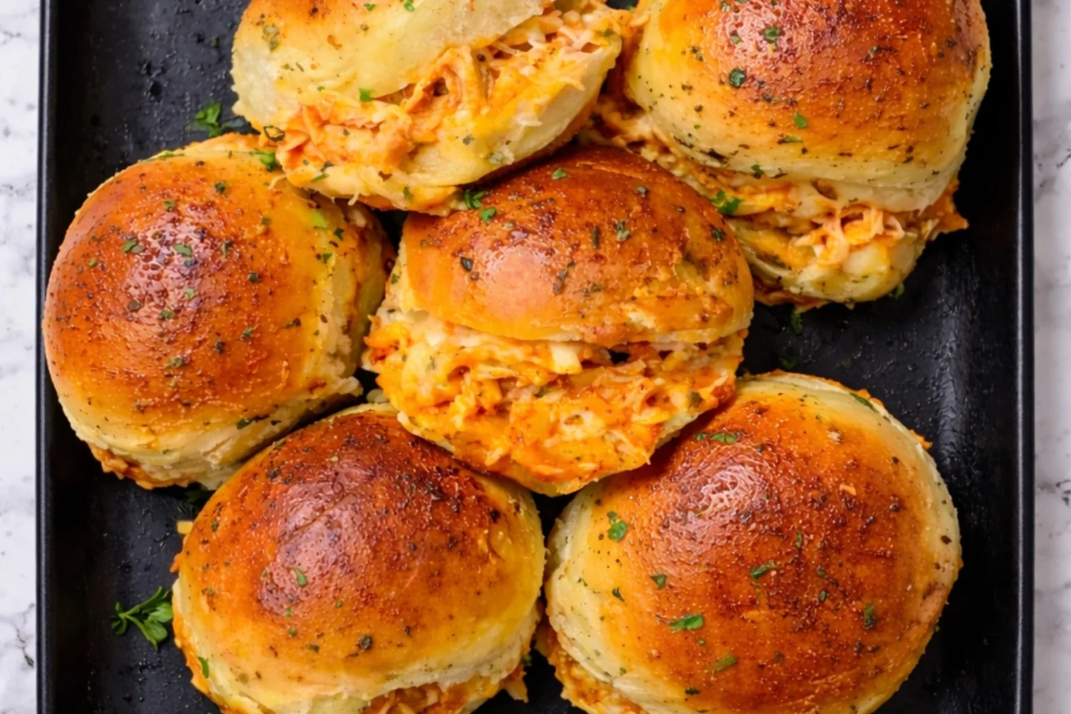 Spicy Buffalo Chicken Sliders with Cheesy Filling and Toasted Buns