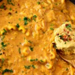 Creamy vegan lasagna soup in a skillet with pasta noodles and cashew cream topping