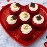 Red velvet cake minis with cream cheese frosting on heart plate