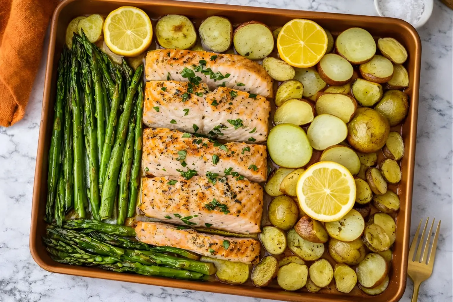 Sheet pan salmon with roasted asparagus, baby potatoes, and fresh lemon slices