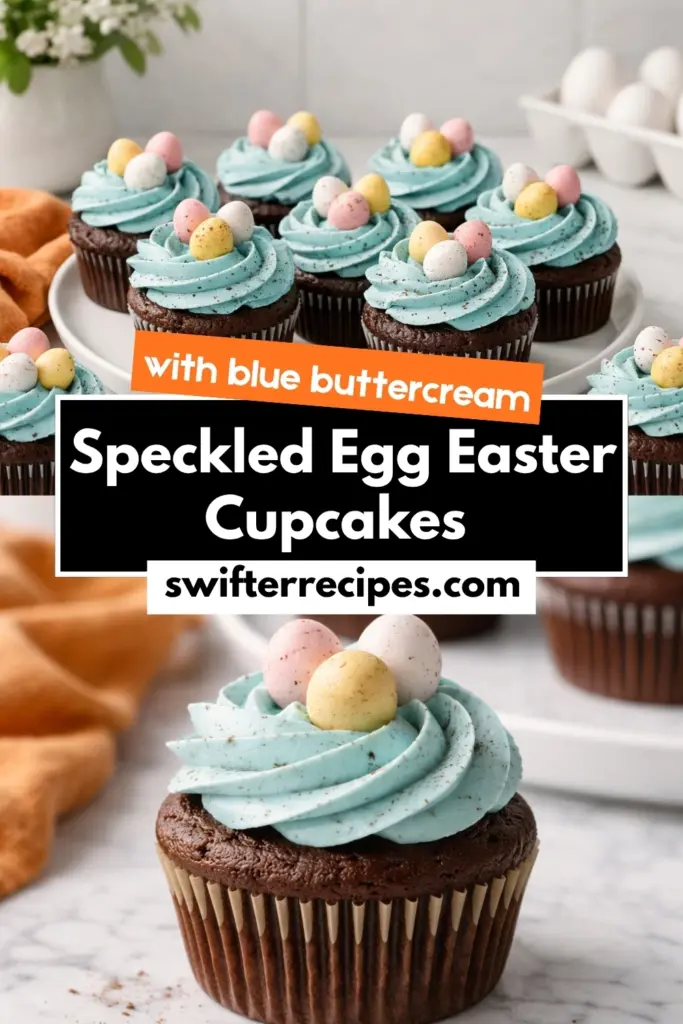 Speckled Egg Easter Cupcakes with blue buttercream and mini chocolate eggs on marble countertop