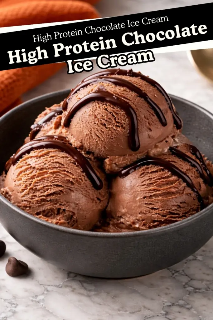 high protein chocolate ice cream made with cottage cheese served in a dark bowl with chocolate drizzle on marble countertop with text overlay