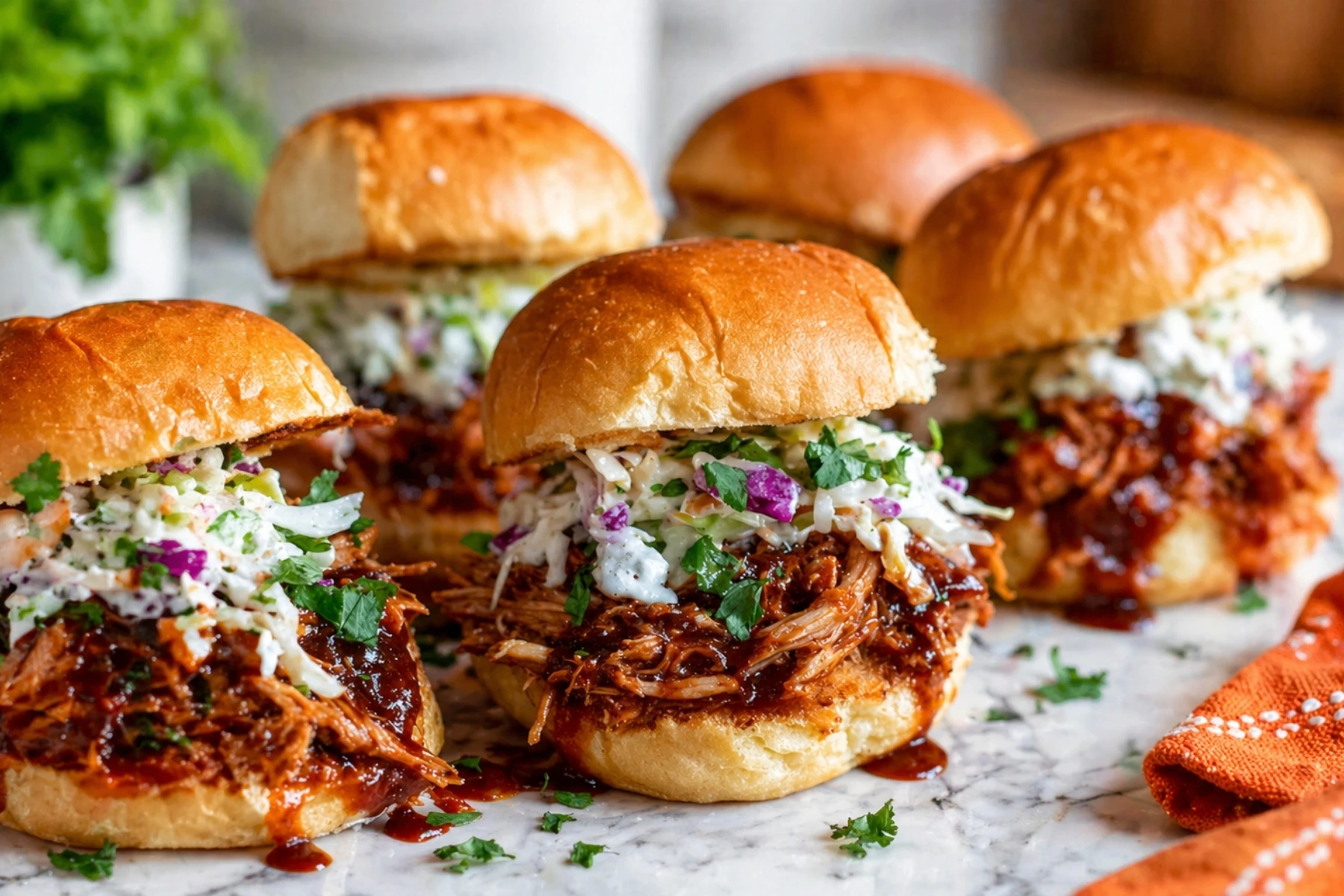 BBQ Chicken Sliders with Coleslaw on Marble Countertop