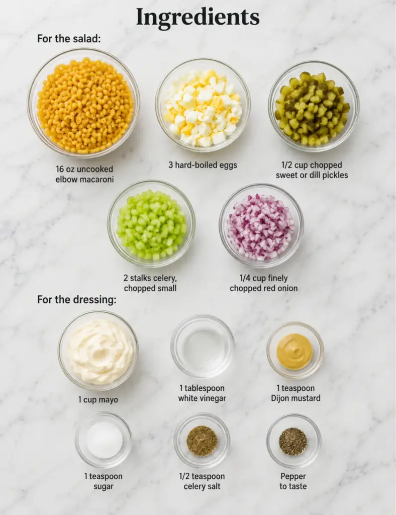 Macaroni salad ingredients in glass bowls with elbow macaroni, eggs, pickles, celery, red onion, mayo, vinegar, Dijon mustard, sugar, celery salt, and pepper on a marble countertop.