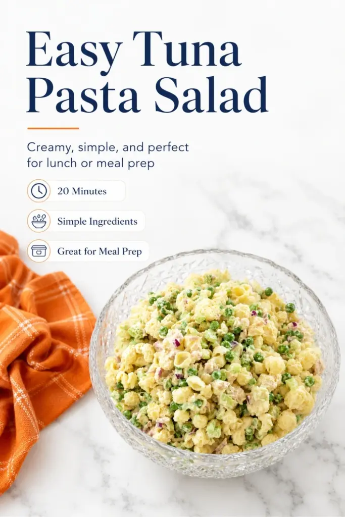 Easy tuna pasta salad in a crystal bowl with shell pasta, peas, celery, red onion, and creamy dressing on a white marble countertop.