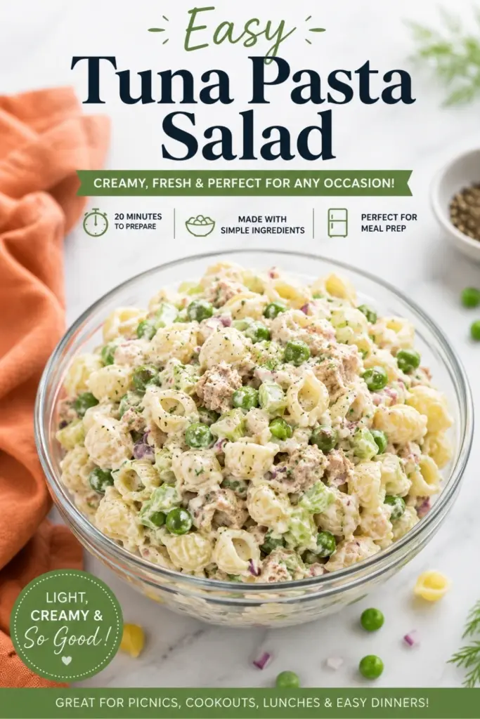 Easy tuna pasta salad with shell pasta, tuna, peas, celery, red onion, and creamy dressing in a glass bowl on a marble countertop.