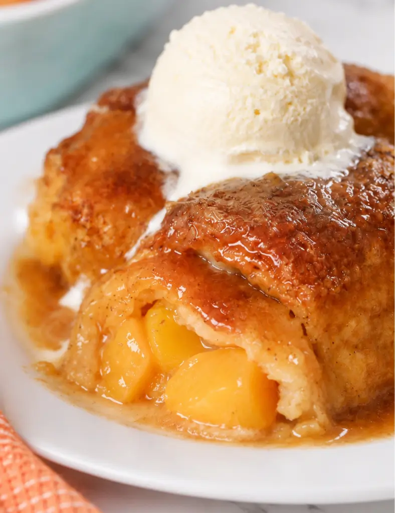 Peach Dumplings with Crescent Rolls close-up with vanilla ice cream