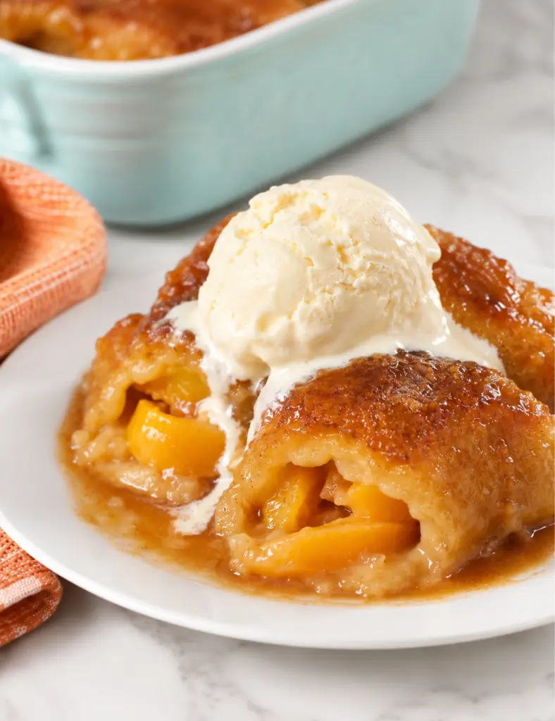 Peach Dumplings with Crescent Rolls with vanilla ice cream and peach filling